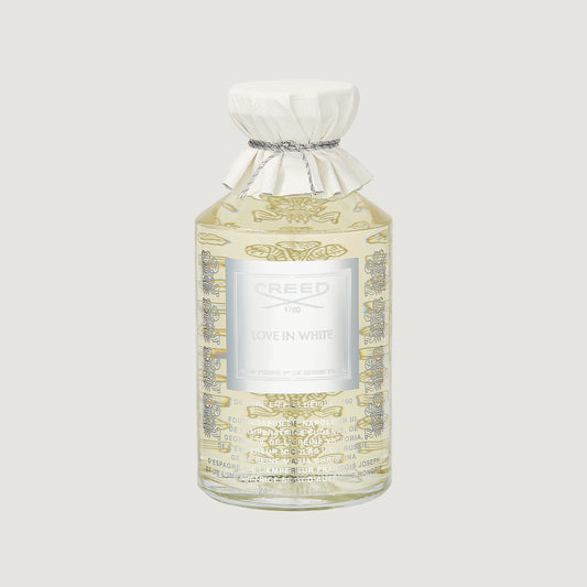 Creed Love in White perfume bottle on a light gray background